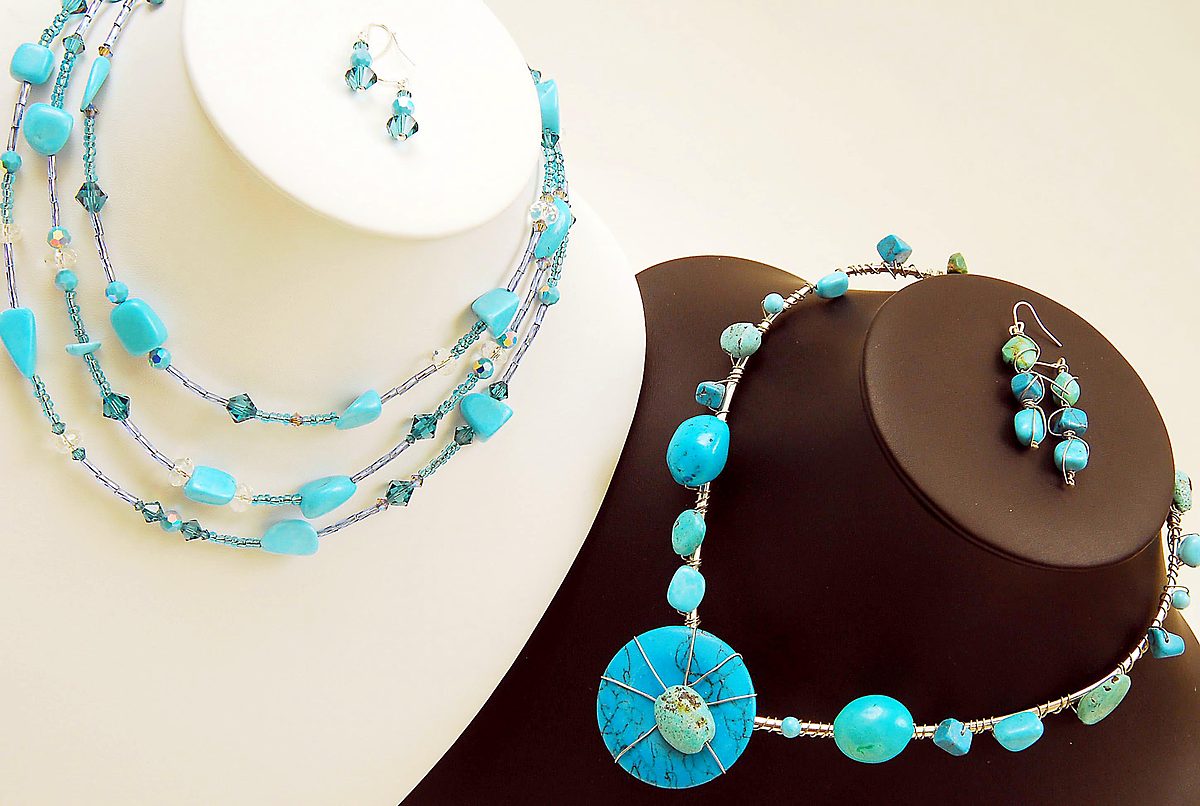 Turquoise multi-strand necklace and a wire-wrapped turquoise collar with earrings