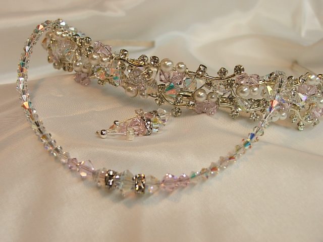 Crystal and pearl bridal headpiece with matching earrings on satin